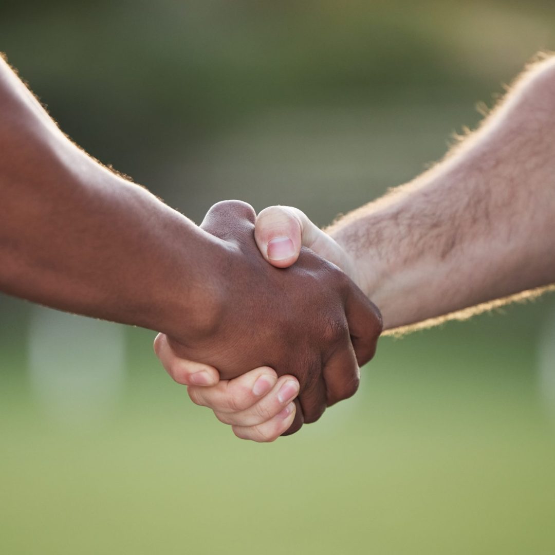 People, handshake and team sports for motivation, meeting or partnership together in nature. Closeu.
